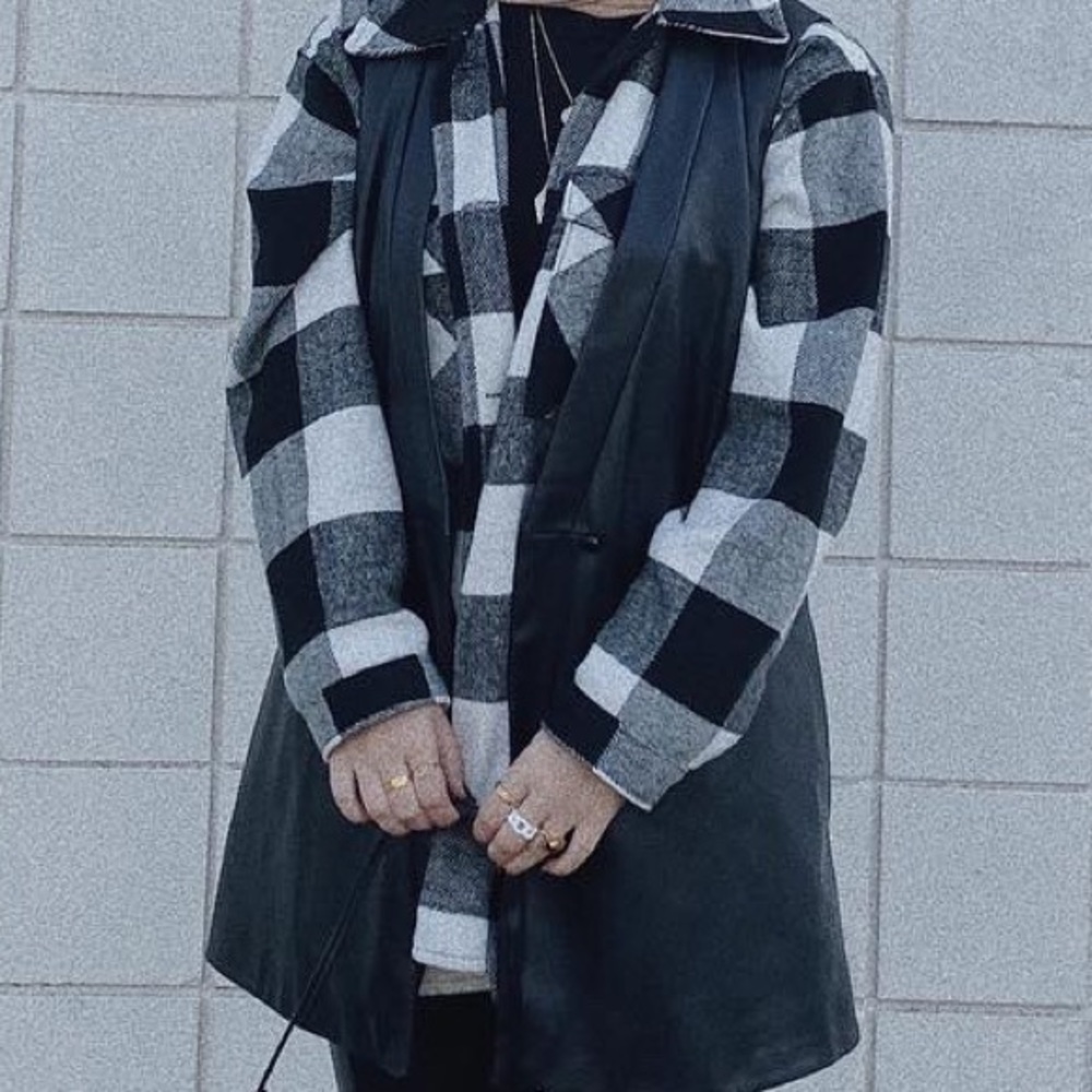 Black leather sleeveless jacket